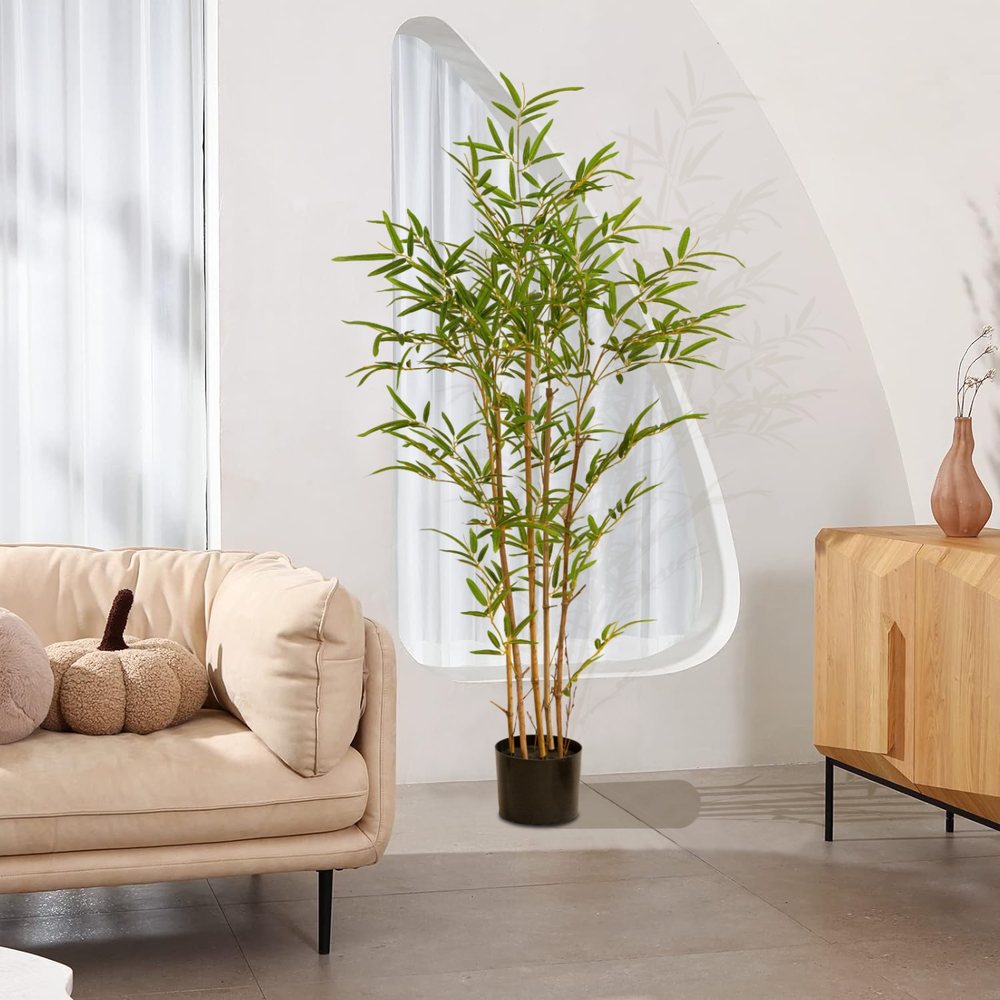 A Natural Guest artificial bamboo plant in a bright, modern home
